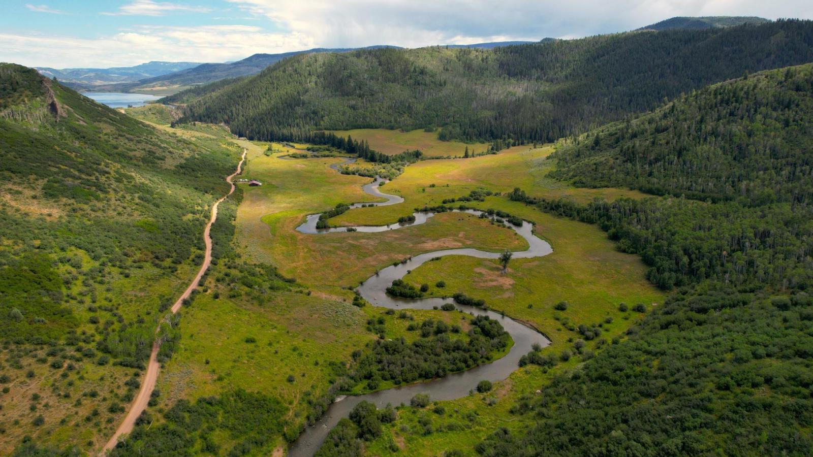 Aerial photo of a winding stream in the mountains.